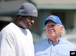In this April 19, 2017 photo, Bart Bartholomew, right, who in 1992 was photographing the riots that erupted in Los Angeles after the acquittal of police officers in the Rodney King beating trial, talks with Tim Goldman, a videographer who helped Bartholomew.