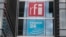 FILE - The headquarters of French national audiovisual media company group France Medias Monde (FMM), displays signage for Radio France Internationale (RFI) and France 24, in Issy-les-Moulineaux, near Paris, April 9, 2019.