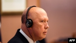 FILE - Australian Defense Minister Peter Dutton holds a meeting at Parliament House in Canberra on Dec. 13, 2021.