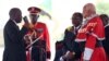 Tanzania's President-elect John Magufuli (L) takes the Oath of Office during his inauguration ceremony at the Uhuru Stadium in Dar es Salaam, Nov. 5, 2015. 