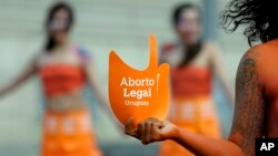 FILE - Pro-abortion activists protest in front of the Uruguayan Congress in Montevideo, Uruguay, Tuesday, Sept. 25, 2012. In 2022, in Uruguay, abortion is permitted on-demand. (AP Photo/Matilde Campodonico, File)