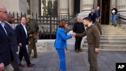 In this image released by the Ukrainian Presidential Press Office on May 1, 2022, Ukrainian President Volodymyr Zelenskyy, center right, and US Speaker of the House Nancy Pelosi shake hands during their meeting in Kyiv, Ukraine, April 30, 2022.