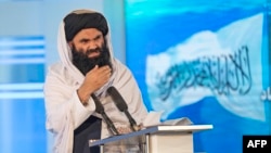 FILE - Taliban acting Interior Minister Sirajuddin Haqqani speaks in Kabul on April 28, 2022. Haqqani is the lone senior Taliban official who has spoken out so far about the Israel-Hamas war, saying only that "we have faith-based sympathy with Muslims.”