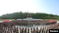 Military personnel from the Korean People's Army medical corps attend the launch of a campaign to improve the supply of medicines, during an outbreak of COVID-19 in Pyongyang, North Korea. Undated photo by Korean Central News Agency via Reuters.