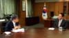 South Korean President-elect Yoon Suk-yeol, right, is interviewed in late April 2022 by VOA's Korean Service Chief Dong Hyuk Lee, in Yoon's office in Seoul. (VOA Korean Service)