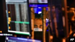 A trader works on the floor at the New York Stock Exchange in New York, May 19, 2022.