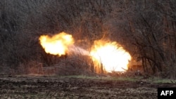 FILE - Ukrainian artillery shells Russian troops' position on the front line near Lysychansk in the Luhansk region, April 12, 2022.