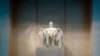 The larger-than-life statue of Abraham Lincoln is made from marble that was carved and put together in pieces. 