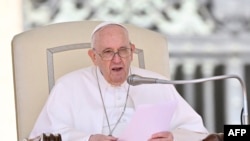 Pope Francis speaks during the open-air general audience in St. Peter's square at the Vatican on May 11, 2022. 