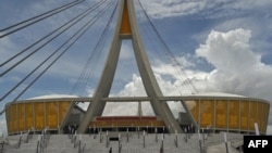 Police patrol outside the Morodok Techo National Stadium, funded by China's grant aid under its Belt and Road Initiative, during the stadium's handover ceremony in Phnom Penh on Sept. 12, 2021.