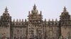 FILE - People take part in the annual rendering of the Great Mosque of Djenne in central Mali on April 28, 2019.