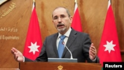 FILE - Jordan's Foreign Minister Ayman Safadi speaks during a news conference in Amman, Jordan, Aug. 16, 2021. 