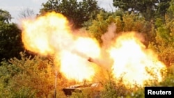 A self-propelled howitzer 2S1 Gvozdika of pro-Russian troops fires a leaflet shell in the direction of Sievierodonetsk to disperse information materials from their combat positions in the Luhansk region, Ukraine May 24, 2022. 