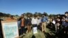 Members of the Goringhaicona Khoi Khoin Indigenous Traditional Council and protestors from surrounding communities hold placards during a picket against the construction of the new African headquarters for U.S. retail giant Amazon, in Cape Town, South Africa, Nov. 12, 2021. 