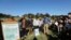 Members of the Goringhaicona Khoi Khoin Indigenous Traditional Council and protestors from surrounding communities hold placards during a picket against the construction of the new African headquarters for U.S. retail giant Amazon, in Cape Town, South Africa, Nov. 12, 2021. 