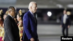 US President Joe Biden walks during his arrival for the G20 Summit at Ngurah Rai International airport in Bali, Indonesia, Nov. 13, 2022. (Made Nagi/Pool via Reuters)