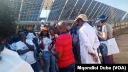 Participants of the Southern African Development Community's energy summit tour a solar project at the Botswana University of Agriculture and Natural Resources on Feb. 28, 2025.