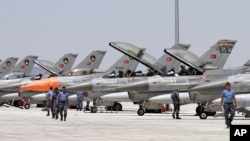 FILE - Dozens of Turkish F-16 jets prepare to take off during Anatolian Eagle exercise at 3rd Main Jet Air Base near the central Anatolian city of Konya, June 15, 2009.