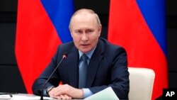Russian President Vladimir Putin speaks during a meeting with leadership of military-industrial complex enterprises in Tula, Russia, Dec. 23, 2022. 