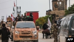 چەکدارانی گرووپی سولەیمان شای سەر بە تورکیا، لە عەفرین (ئەرشیڤ)