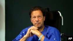 FILE - Former Pakistani Prime Minister Imran Khan in Shaukat Khanum hospital, where is being treated for a gunshot wound in Lahore, Pakistan, on Nov. 4, 2022. 