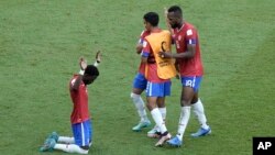 Costa Rica's Keysher Fuller, left, and teammates celebrate after their win in the World Cup, group E soccer match between Japan and Costa Rica, at the Ahmad Bin Ali Stadium in Al Rayyan, Qatar, Nov. 27, 2022.