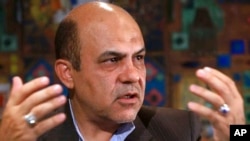 FILE - In this photo released by the KhabarOnline News Agency on June 12, 2019, Ali Reza Akbari speaks in an interview.