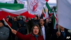 Protesters march past the US Capitol in Washington during a Dec. 17, 2022, rally and vigil in solidarity with ongoing protests in Iran and to honor protesters allegedly killed by the Iranian government. 