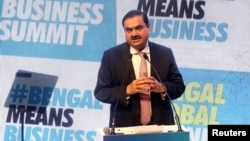 FILE - Indian billionaire Gautam Adani addresses delegates during the Bengal Global Business Summit in Kolkata, India, April 20, 2022. 