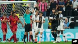 Spain's goalkeeper Unai Simon, second from right, embraces Germany's Antonio Ruediger at the end of the World Cup group E soccer match between Spain and Germany, at the Al Bayt Stadium in Al Khor , Qatar, Nov. 27, 2022.