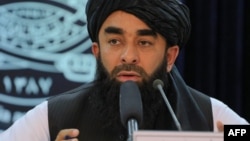 FILE - Taliban spokesman Zabihullah Mujahid speaks during a press conference in Kabul, Nov. 5, 2022.