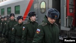 Russian conscripts called up for military service walk along a platform before boarding a train at a railway station in Omsk, Russia Nov. 27, 2022.
(Alexey Malgavko/REUTERS)
