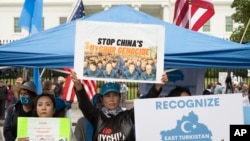 FILE - East Turkistan Awakening Movement holds a rally outside the White House against the Chinese Communist Party (CCP) to coincide with the 73rd National Day of the People's Republic of China in Washington, Oct. 1, 2022. 