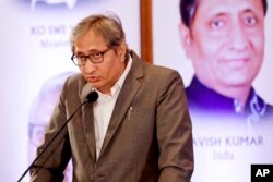 FILE - Ravish Kumar of India speaks in Manila, Philippines, Sept. 6, 2019.