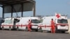 FILE - Lebanese Red Cross vehicles are parked at the Lebanese-Syrian border crossing in Arida, Lebanon, Sept. 23, 2022.