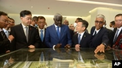 China's Foreign Minister, Qin Gang, second left, and African Union Commission Chair Moussa Faki Mahamat, center, attend the inauguration of the Africa Centers for Disease Control and Prevention in Addis Ababa, Ethiopia, Jan. 11, 2023.