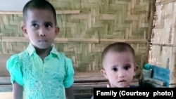 Noor Fatema, 5, and Umme Mah, 3, as photographed on Dec. 1, 2022, in Bangladesh, one day before they boarded the boat for Malaysia with their mother, Ayesha Khatoon. 
