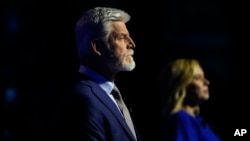 FILE - Presidential candidate Petr Pavel, left, and Danuse Nerudova wait for the start of a political debate at the National Museum in Prague, Czech Republic, Jan. 8, 2023.