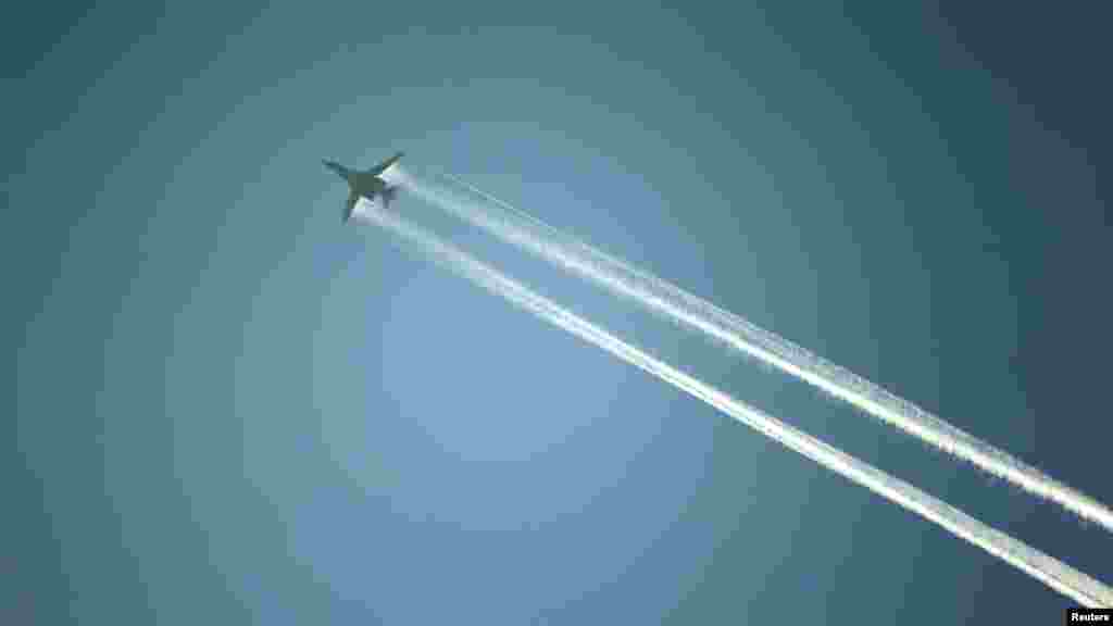 A U.S.-led coalition aircraft flies over Kobani, near the Turkish-Syrian border, Oct. 15, 2014. 