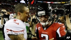 San Francisco quarterback 49ers Colin Kaepernick, left, speaks with Atlanta Falcons quarterback Matt Ryan during the second half of the NFL football NFC Championship game, Jan. 20, 2013, in Atlanta.