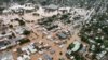FILE - A handout from the New South Wales State Emergency Service shows floodwaters inundating the city of Lismore, March 31, 2022.