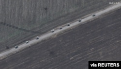 FILE - A satellite image shows an overview of tanks on road south of Izyum, Ukraine, March 24, 2022. (2022 Maxar Technologies/Handout via Reuters)