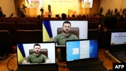 Ukrainian President Volodymyr Zelenskyy addresses South Korean parliamentary via video link at national assembly in Seoul, April 11, 2022.