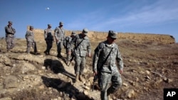 FILE - U.S. Army soldiers tour St. Elijah's Monastery on Forward Operating Base Marez in Mosul, Iraq.