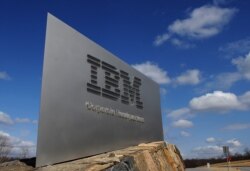 In this file photo taken on March 20, 2009, a sign marks the entrance to IBM Corporate Headquarters in Armonk, New York.