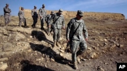 FILE - U.S. Army soldiers tour St. Elijah's Monastery on Forward Operating Base Marez in Mosul, Iraq.