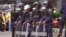 FILE - Liberia security forces in riot gear in the city of Monrovia, Liberia, Aug. 20, 2014. 