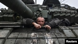FILE - A member of a tank battalion of the 128th Mountain Assault Transcarpathian Brigade of Ukraine's armed forces attends a training session amid Russia's attack on the country, in the Zaporizhzhia region of Ukraine, Jan. 28, 2025.