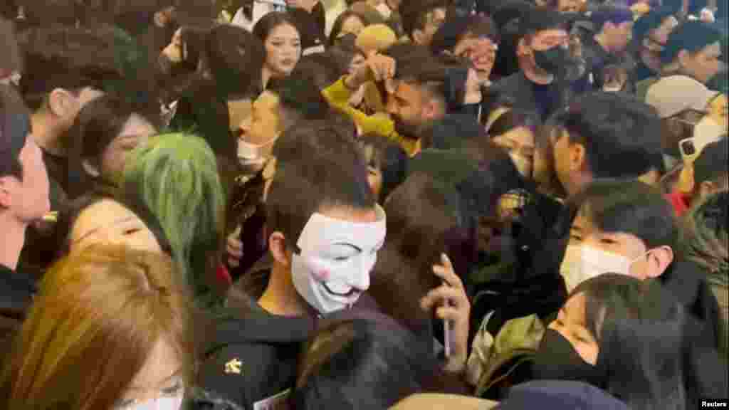 A view of a dense crowd during a Halloween festival in Seoul, South Korea, Oct. 29, 2022, is seen in this screengrab obtained from a social media video.
