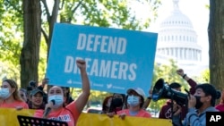 FILE - People rally outside the Capitol in support of the Deferred Action for Childhood Arrivals (DACA), during a demonstration on Capitol Hill in Washington, Oct. 6, 2022.